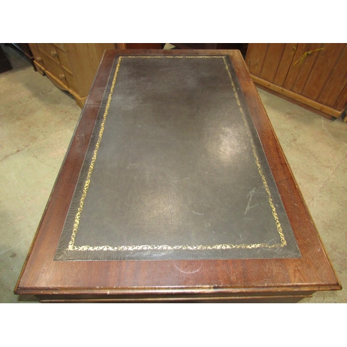 2249 - A reproduction Georgian style kneehole twin pedestal writing desk with inset leather top over eight ... 