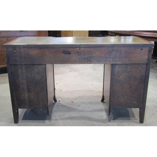 2252 - A reproduction Georgian style kneehole desk with inset leather top and inverted serpentine front fit... 