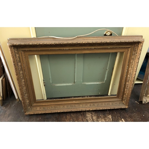 155 - Two Victorian Gilt Wood and Gesso Frames with laurel leaf details (84 x 122 cm) and scrolling Rococo... 