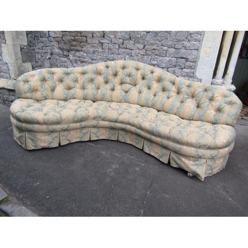 2320 - A good quality Victorian style sofa of curved form with buttoned repeating floral patterned upholste... 