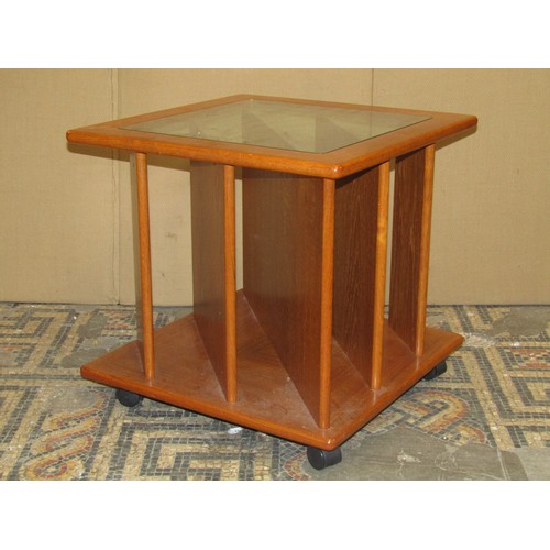 2329 - A retro teak freestanding hall stand, the raised back with applied mirror plate over a frieze drawer... 