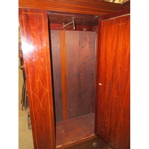 2215 - An inlaid Edwardian mahogany wardrobe with crossbanded and chequered detail, enclosed by a three qua... 