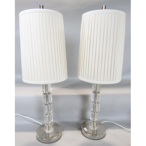 1444 - A pair of perspex column table lamps in five octagonal segments, with pleated shades 55cm tall inc s... 