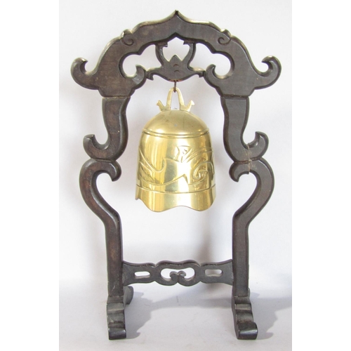 1498 - A small brass Chinese gong hanging from a hardwood frame, 36cm x 18cm.