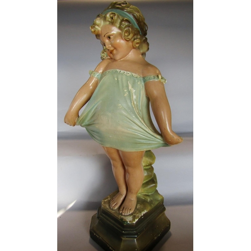 1432 - An early 20th century” Pear’s Soap” like plaster statue of a little girl in a twee pose.  60cm tall ... 