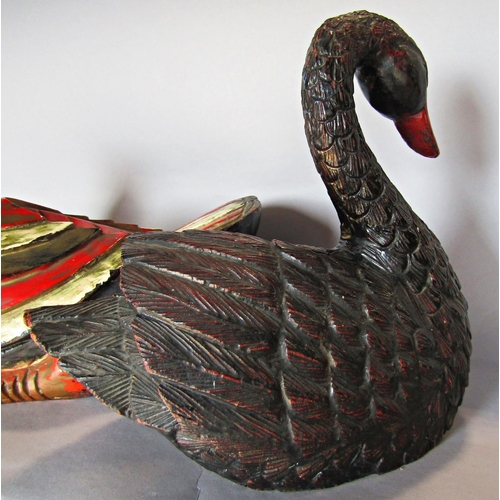 1433 - A wooden polychrome painted duck doorstop/ornament, and a similar resin swan.