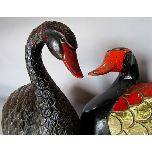 1433 - A wooden polychrome painted duck doorstop/ornament, and a similar resin swan.