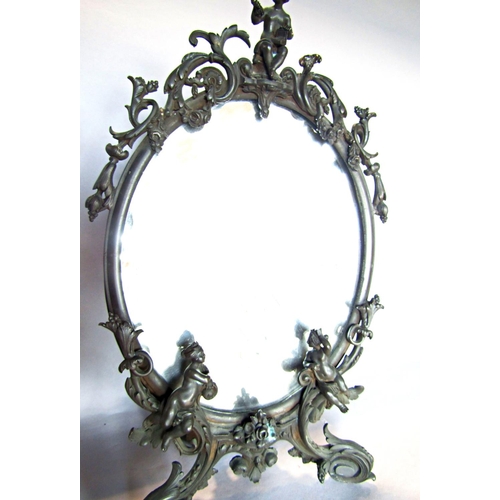 1434 - An ornate Rococo style bronze finished metal dressing table mirror adorned with scrolls, flowers  an... 