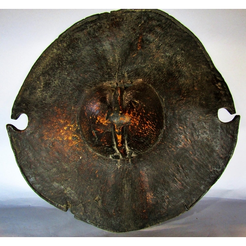 1440 - A Sudanese elephant hide shield from the Beja tribe, 45cm diam.