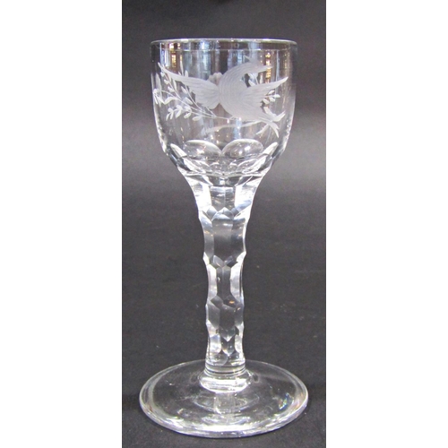 1154 - Three 19th century floral and bird engraved, cut glass wine glasses on faceted stems 14.5cm tall.