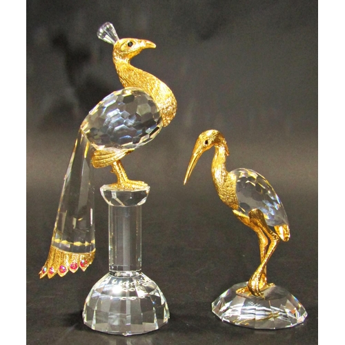 1156 - Two Swarovski cut crystal birds, a peacock and a heron both with gilded embellishments, 16cm and 11c... 