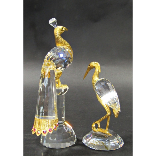 1156 - Two Swarovski cut crystal birds, a peacock and a heron both with gilded embellishments, 16cm and 11c... 