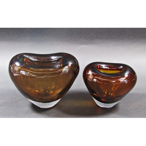 1157 - Two amber glass heart shaped vases by Lutken Holmegaard. 16cm and 14cm tall.