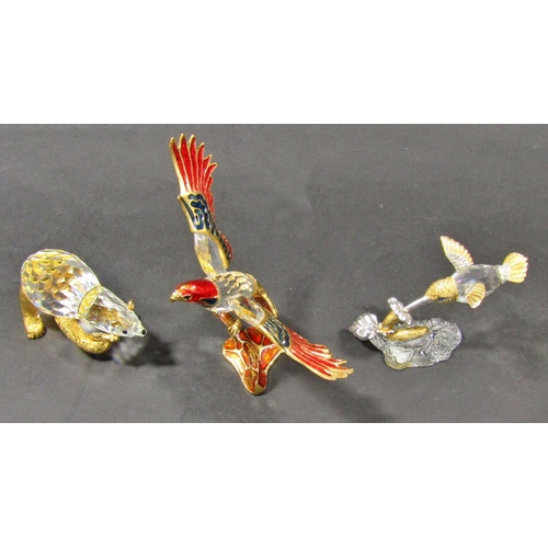 1162 - Three Swarovski cut crystal animals, a bear, a hummingbird, an eagle all with gilded embellishments,... 