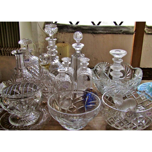 1172 - Eight various cut glass decanters, four varying glass bowls, a frosted glass candlestick, a glass Yo... 