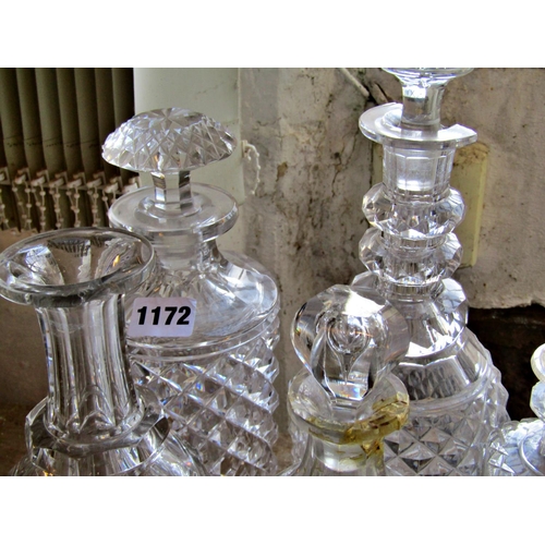 1172 - Eight various cut glass decanters, four varying glass bowls, a frosted glass candlestick, a glass Yo... 