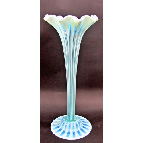 1173 - A Charles Kempton pale blue green ribbed trumpet Art Glass tall vase, on a spread base, 48cm tall.