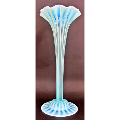 1173 - A Charles Kempton pale blue green ribbed trumpet Art Glass tall vase, on a spread base, 48cm tall.