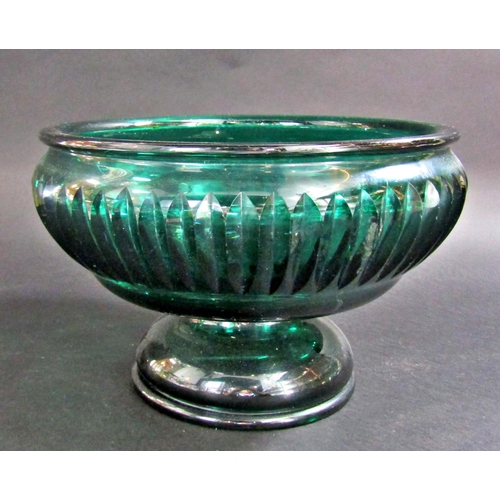 1174 - A Waterford Glass clock, 10cm wide, a heavy green cut glass fruit bowl with ribbed sides, three glas... 