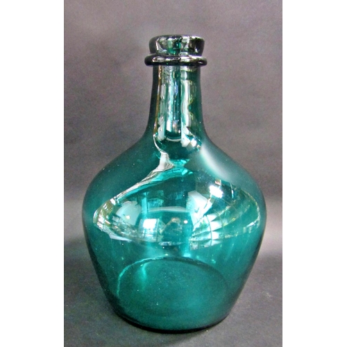 1176 - A Vintage bottle green Demijohn 38cm tall.