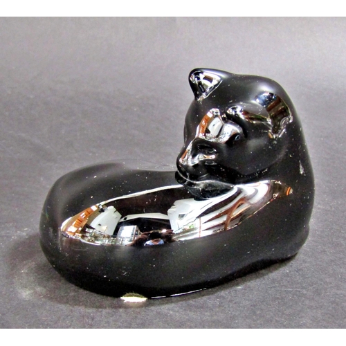 1180 - A black Baccarat glass cat grooming itself, signed to the base, 12cm wide approx.