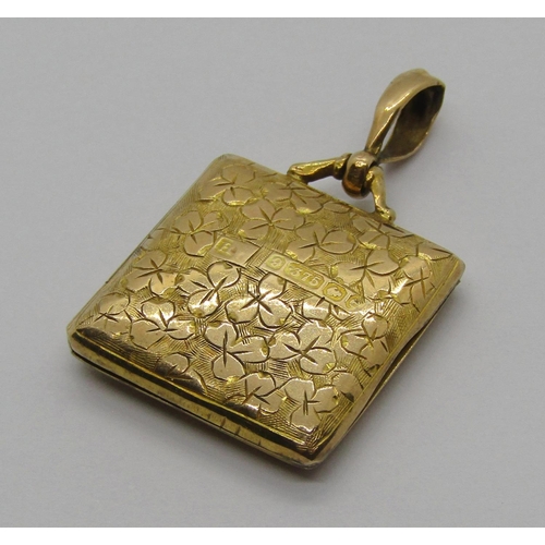 1251 - Edwardian 9ct locket of square form with engraved shamrocks and monogram, 3.4g gross