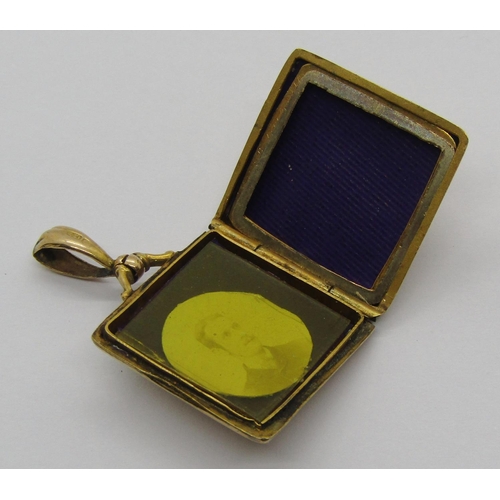 1251 - Edwardian 9ct locket of square form with engraved shamrocks and monogram, 3.4g gross