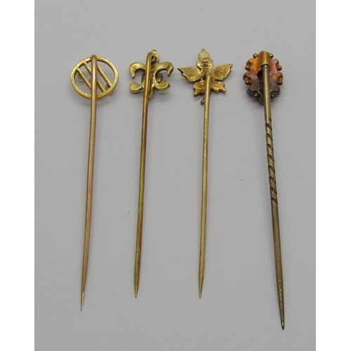 1256 - Four antique gold stick pins; 14k maple leaf example set with seed pearls (centre pearl vacant) cont... 