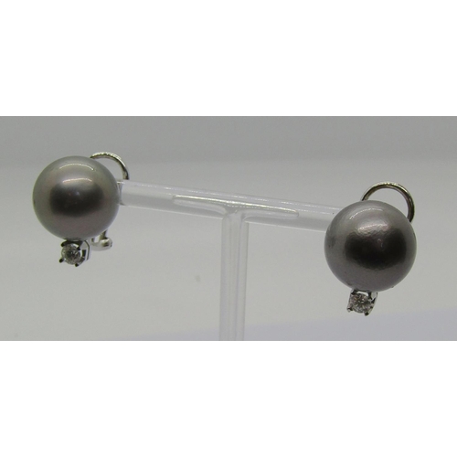 1276 - Pair of Tahitian pearl earrings with 18ct white gold clip fastenings, each set with a diamond 0.20ct... 