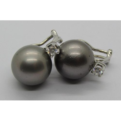 1276 - Pair of Tahitian pearl earrings with 18ct white gold clip fastenings, each set with a diamond 0.20ct... 