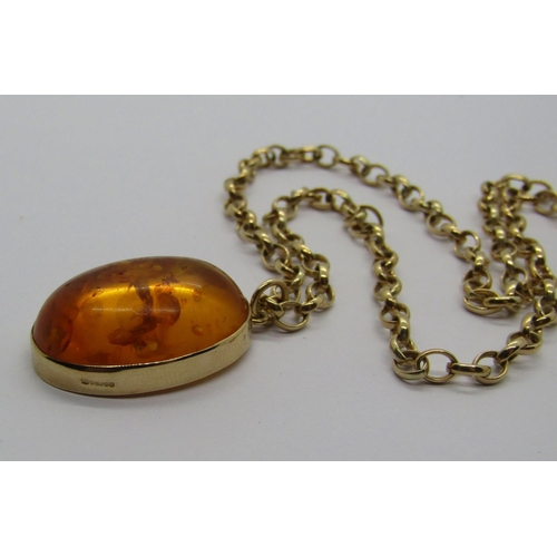 1284 - Vintage 9ct amber pendant necklace, the oval cabochon amber 2.5 x 1.8cm approx, 14.3g