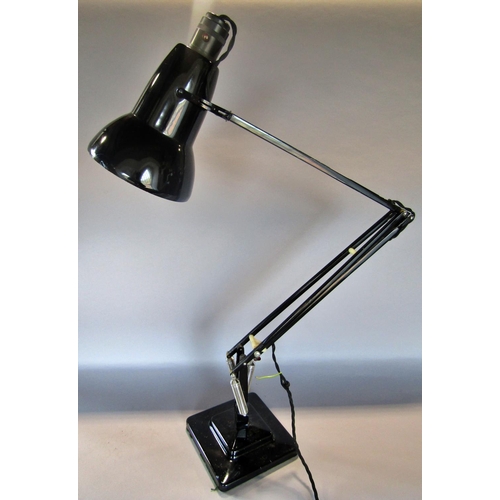 1443 - A mid 20th century black Anglepoise lamp on a stepped base, stamped Made in England by Herbert Terry... 