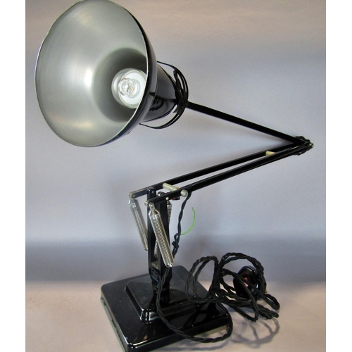 1443 - A mid 20th century black Anglepoise lamp on a stepped base, stamped Made in England by Herbert Terry... 