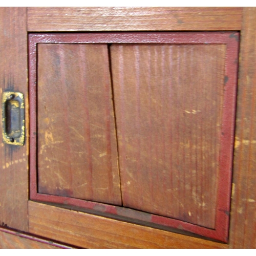 1448 - A miniature pitch pine dresser with a partially shelved upper over two sliding panelled doors, lacks... 