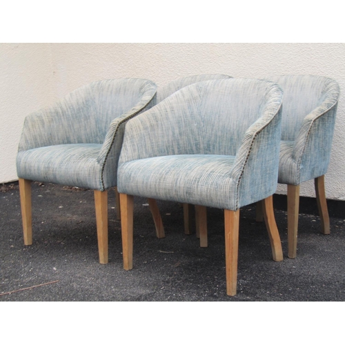 2415 - A set of four upholstered tub chairs on square tapered supports