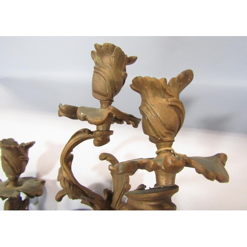 1412 - A pair of 18th century style floral scrolled wall sconces in a gold finish.