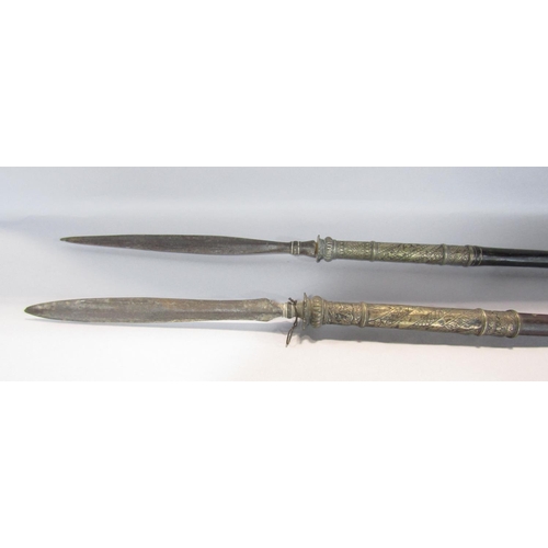 1413 - Two Indian ceremonial spears with incised silver mounts, 150cm and 152cm together with a simple Far ... 