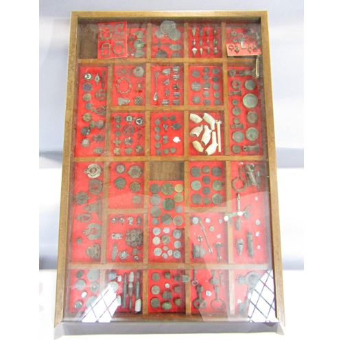 1415 - A framed 24 segmented collectors display of medals, old bullets, thimbles, clay pipes, Regimental ba... 