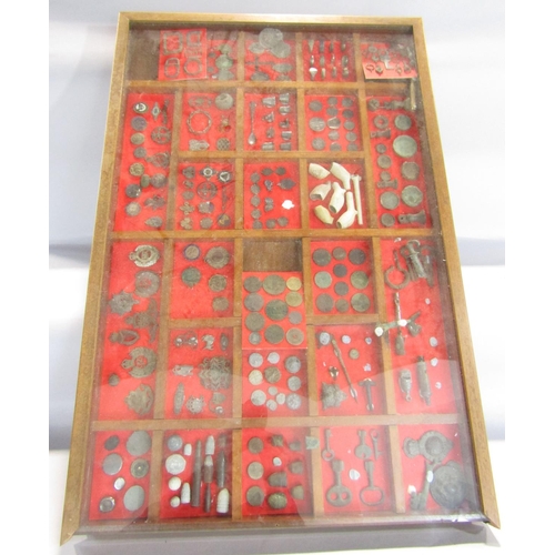 1415 - A framed 24 segmented collectors display of medals, old bullets, thimbles, clay pipes, Regimental ba... 