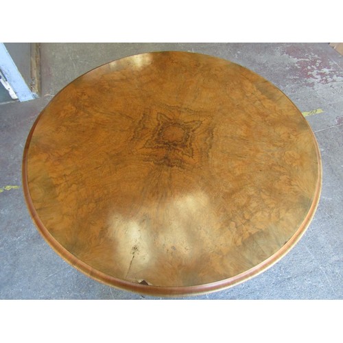 2663 - A Victorian walnut figured walnut centre table, the circular top with segmented veneers raised on ca... 