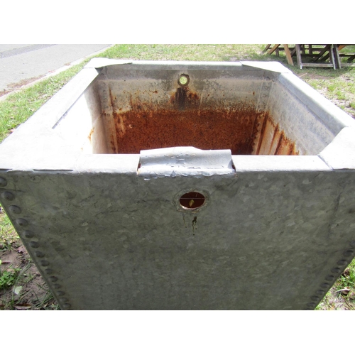 2039 - A square galvanised steel water tank with pop riveted seams, 55cm square