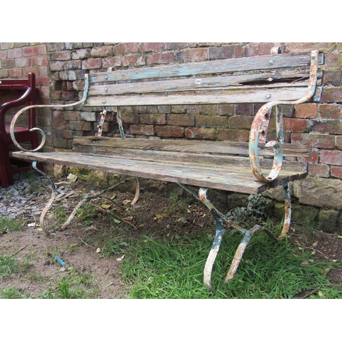 2043 - A vintage painted and weathered sprung steel garden bench with wooden lathes, (af) 150cm wide