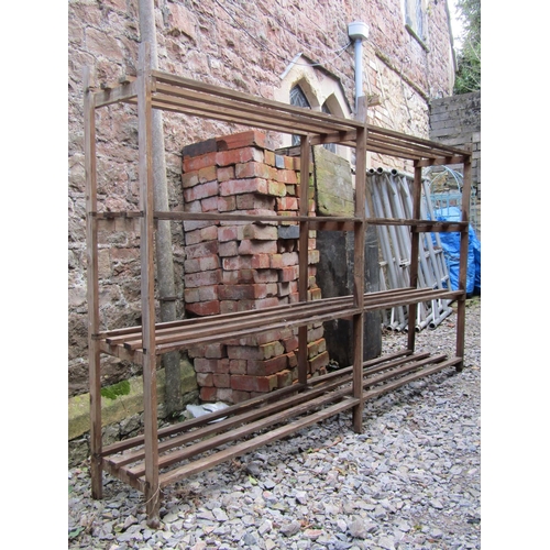 2046 - A Vintage pine shelving unit with slatted framework, 234cm wide x 38cm deep x 156cm high (af)