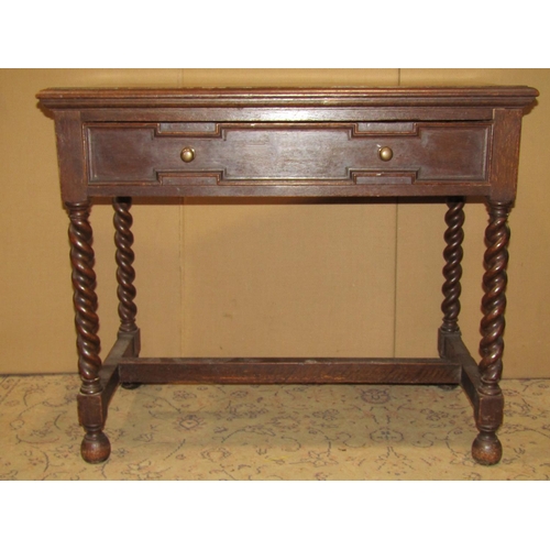 2103 - A Jacobean revival oak side table, with geometric moulded frieze drawer, raised on spiral twist supp... 