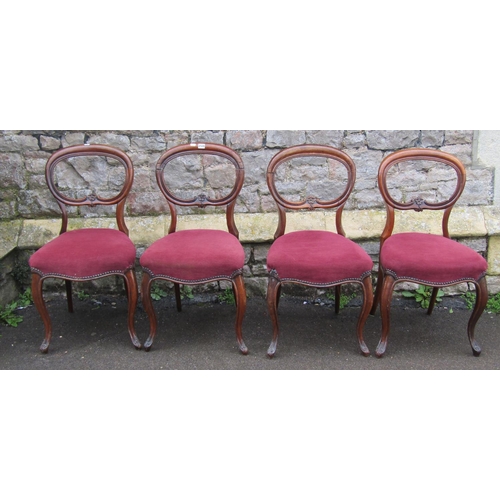 2124 - Set of four Victorian rosewood dining chairs with kidney shaped backs, over upholstered serpentine f... 