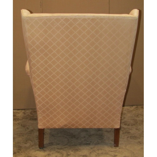 2153 - Georgian style wing armchair with light pink ground, repeating lattice patterned upholstery, loose s... 