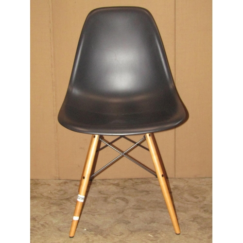 2209 - Vitra Eames DSW side chair in deep black colourway, raised on golden maple splayed legs