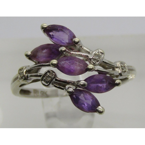 1299 - Stylised 9ct white gold amethyst and diamond dress ring, together with a further silver ring and nin... 