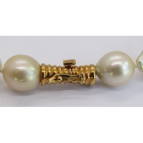 1343 - Three necklaces comprising a baroque pearl example with 18ct clasp, a stylised silver example with c... 