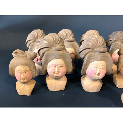 1048A - Nineteen Chinese Figurative Items: Seventeen Tang type court lady heads, a carved and polychrome pai... 